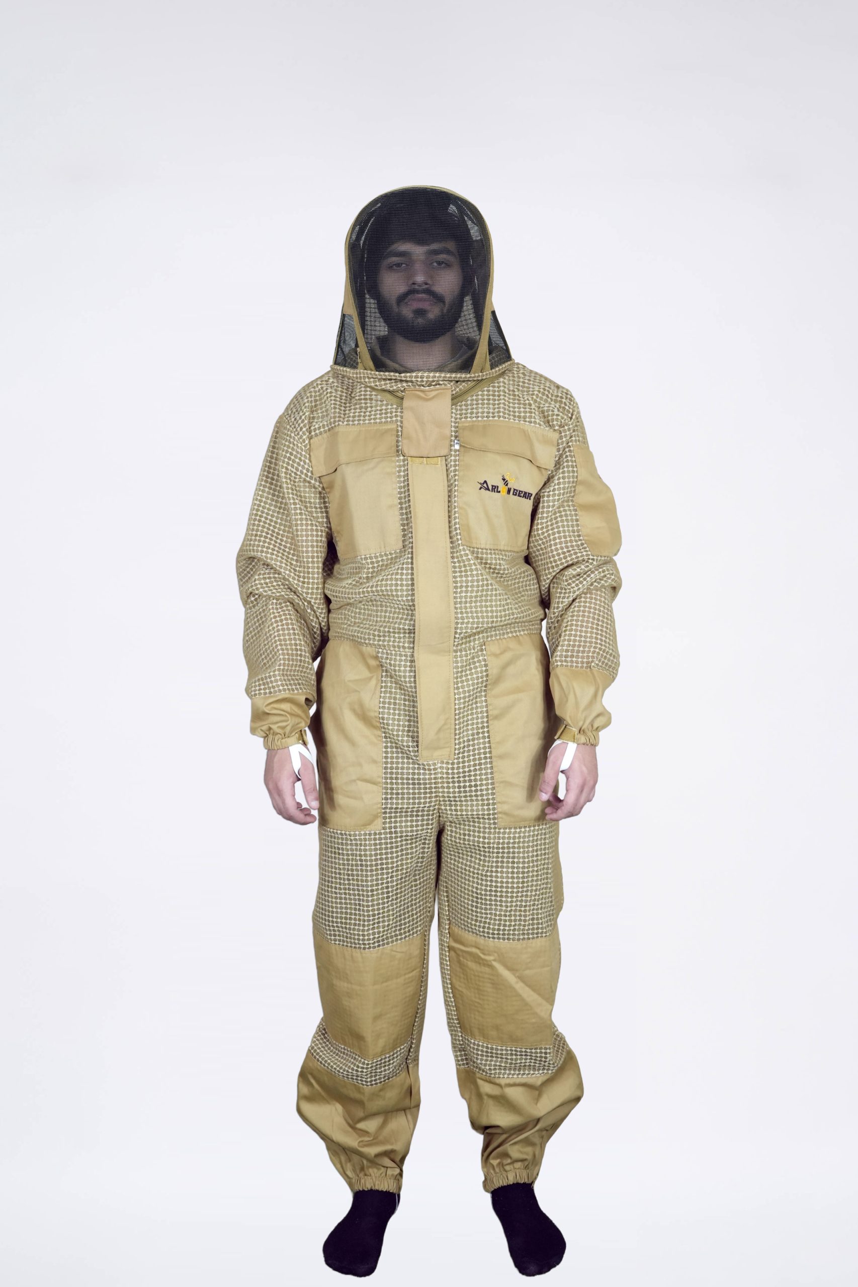 Beekeeper wearing breathable tan fencing veil suit with zip pockets and knee pads