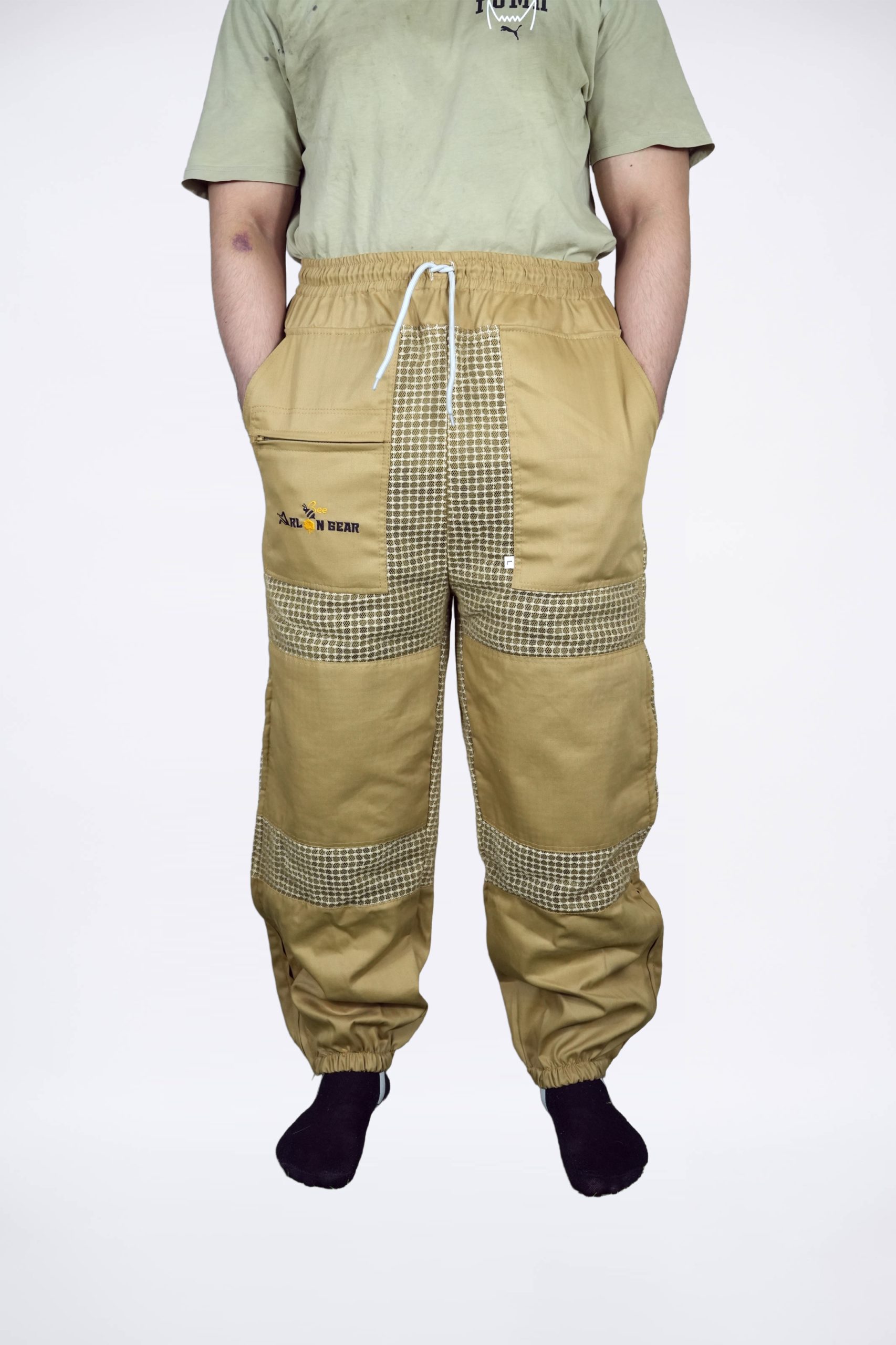 Khaki tan beekeeping trousers with ventilated mesh panels at thigh and calf, zip pocket, and elastic drawstring waist